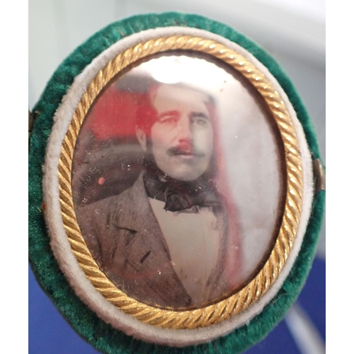 512 - MINIATURE WATERCOLOUR PORTRAIT IN A LEATHER CASE dated 1862, with a small oval cased Daguerrotype ph... 