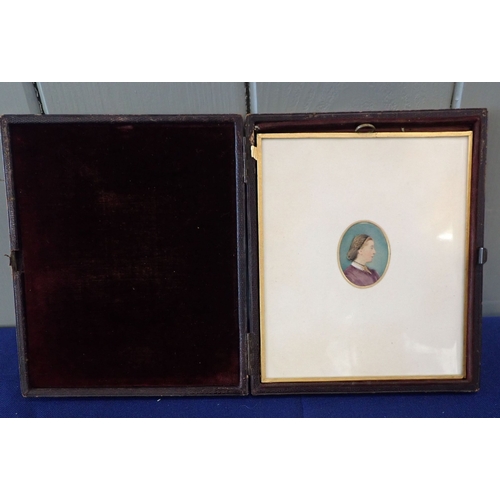 512 - MINIATURE WATERCOLOUR PORTRAIT IN A LEATHER CASE dated 1862, with a small oval cased Daguerrotype ph... 