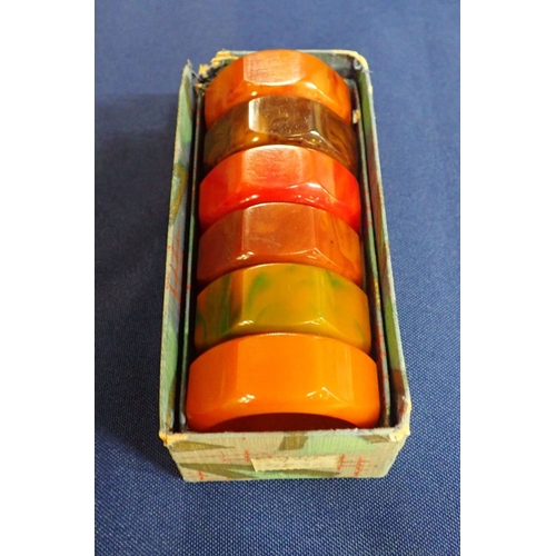 59 - A SET OF SIX COLOURED BAKELITE NAPKIN RINGS a collection of porcelain and enamelled trinket boxes an... 