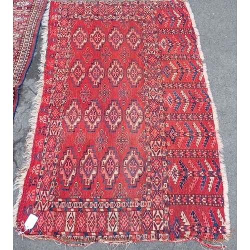 666 - AN ANTIQUE TEKKE TURKMEN RUG woven in off white and blue with three rows of eight guls on a cochinea... 