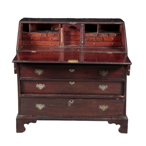 716 - A GEORGE III MAHOGANY BUREAU 18th century, the fall-front opening to a fitted interior, with drawers... 