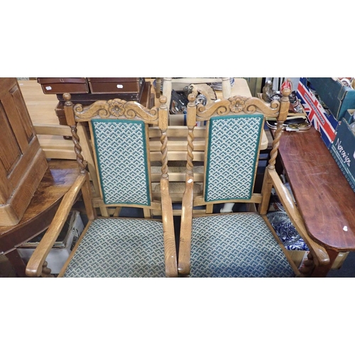 722 - A PAIR OF 1920S LIGHT OAK ARMCHAIRS with barley-twist legs and supports, and upholstered back panels... 