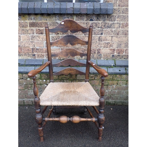 754 - AN ASH LADDERBACK ARMCHAIR with rush seat 64cm wide, and a reproduction Lancashire type armchair (2)