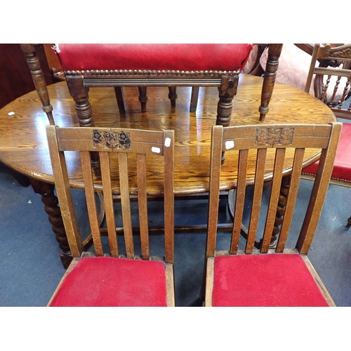 778 - A 1920S OAK OVAL DINING TABLE WITH BARLEY-TWIST LEGS and a collection of chairs