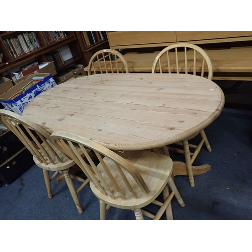 791 - A COUNTRY STYLE PINE DINING TABLE and four hoop-backed chairs