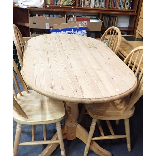 791 - A COUNTRY STYLE PINE DINING TABLE and four hoop-backed chairs