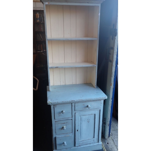 795 - A SMALL PAINTED KITCHEN DRESSER with asymmetrical arrangement of drawers and cupboard 70cm wide