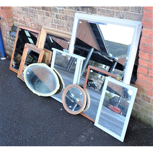 799 - A MAPLE FRAMED WALL MIRROR with bevelled plate, a stripped pine framed mirror, and others