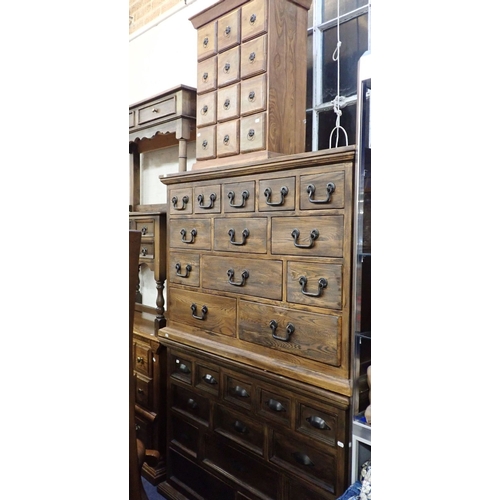 802 - TWO SETS OF STAINED DRAWERS of traditional style 200cm wide, and a narrower set (3)