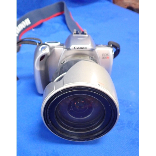 95 - A CANON EOS CAMERA fitted with TAMRON Objective 300-28mm lens together with a digital photo frame an... 