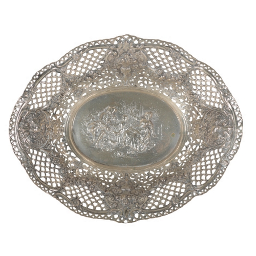 17 - A LATE 19TH CENTURY GERMAN SILVER OVAL BASKET pierced and embossed with a family in a garden to the ... 