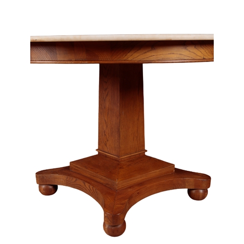 187 - AN OAK AND MARBLE TOPPED CENTRE TABLE the circular top on a tapered square section stem, to a moulde... 