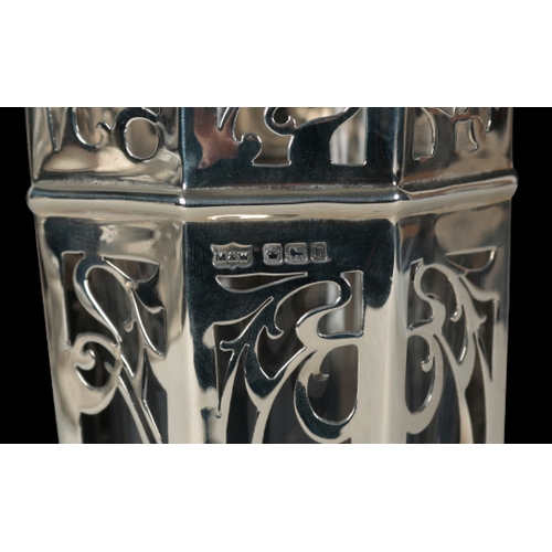 19 - AN EDWARD VII SILVER VASE BY MAPPIN & WEBB the pierced octagonal body of Art Nouveau style, with ste... 