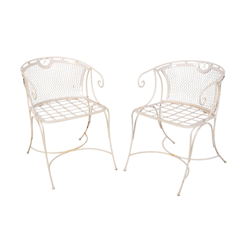 190 - A SET OF FOUR WHITE-PAINTED GARDEN CHAIRS 20th century, with scrolled arms above pierced backs and s... 