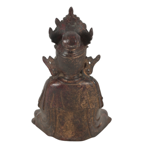 192 - A CHINESE BRONZE BUDDHA seated wearing an elaborate headdress, with traces of red and gilt lacquer s... 