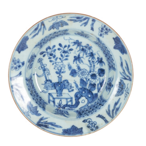 193 - TWO SIMILAR 18TH CENTURY CHINESE BLUE & WHITE DISHES decorated with floral designs with trellis bord... 