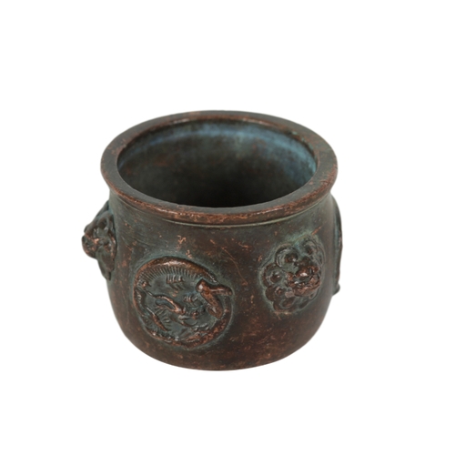 199 - A MINIATURE CHINESE BRONZE VESSEL decorated with lions masks alternating with coiled dragons, 5cm di... 