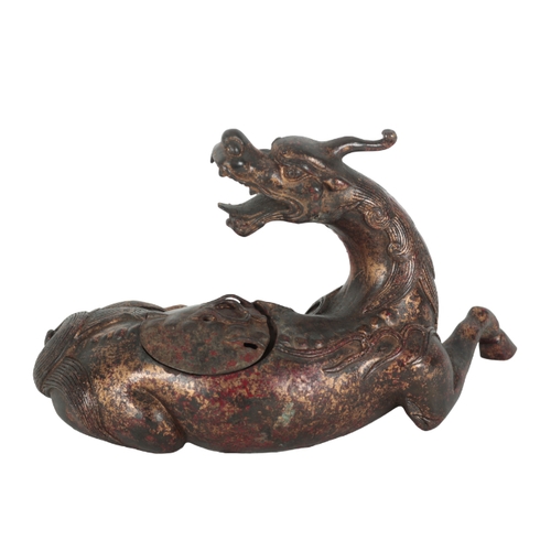 200 - A CHINESE BRONZE INCENSE BURNER modelled as a recumbent mythical lion with a well-defined mane and t... 