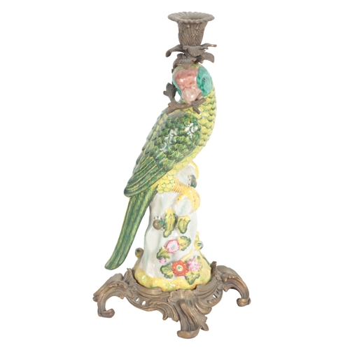 209 - A PAIR OF PORCELAIN AND GILT METAL MOUNTED CANDLESTICKS 20th century, in the form of parrots holding... 