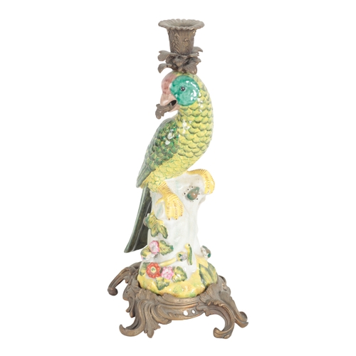 209 - A PAIR OF PORCELAIN AND GILT METAL MOUNTED CANDLESTICKS 20th century, in the form of parrots holding... 