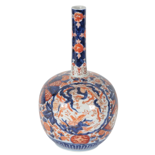 213 - A JAPANESE IMARI BOTTLE VASE Meiji period, decorated in the Imari pattern, the bulbous body with a l... 