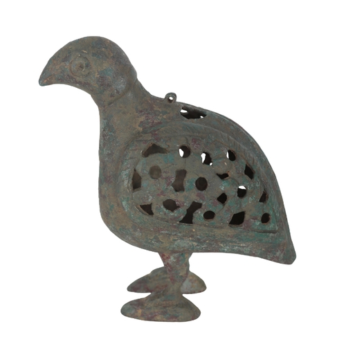 218 - AN ISLAMIC BRONZE INCENSE BURNER in the form of a bird with pierced wings and a rectangular aperture... 