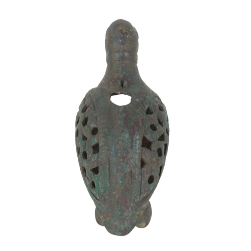 218 - AN ISLAMIC BRONZE INCENSE BURNER in the form of a bird with pierced wings and a rectangular aperture... 