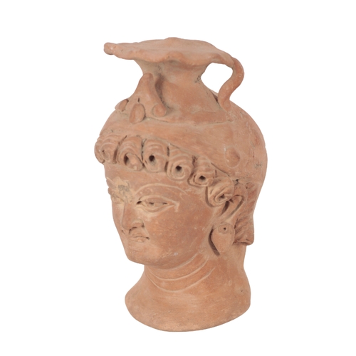 226 - A GANDHARAN STYLE TERRACOTTA HEAD on a modern metal stand, 13cm high; and three other 