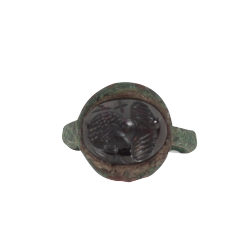 228 - A COLLECTION OF FIVE ROMAN STYLE BRONZE RINGS with stone intaglio decoration (5)