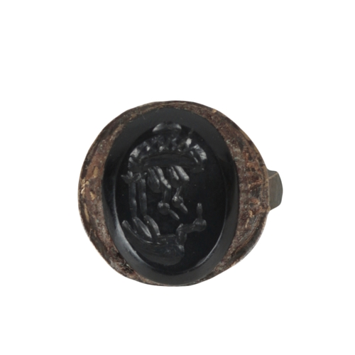 228 - A COLLECTION OF FIVE ROMAN STYLE BRONZE RINGS with stone intaglio decoration (5)