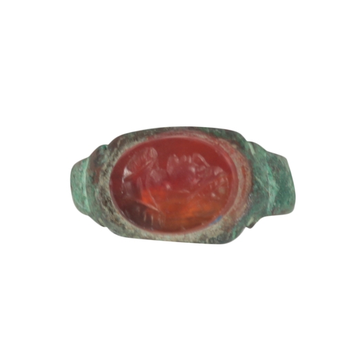 228 - A COLLECTION OF FIVE ROMAN STYLE BRONZE RINGS with stone intaglio decoration (5)