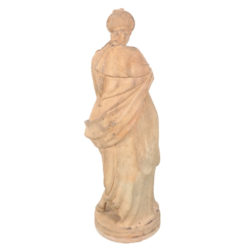 243 - A FRENCH TERRACOTTA FIGURE OF A WOMAN WITH A WATER JUG after the Antique, mid-19th Century, 96cm hig... 