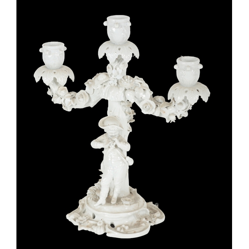 246 - A PAIR OF 'MEISSEN' BLANC DE CHINE PORCELAIN FIGURAL CANDELABRA late 19th/early 20th century, with c... 