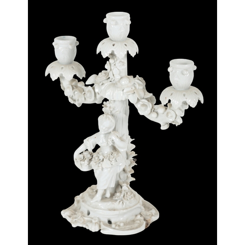 246 - A PAIR OF 'MEISSEN' BLANC DE CHINE PORCELAIN FIGURAL CANDELABRA late 19th/early 20th century, with c... 