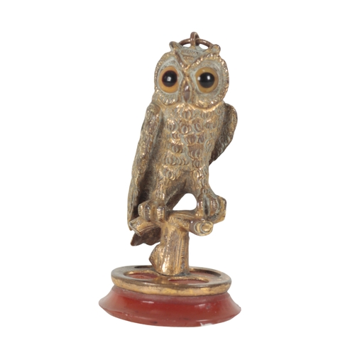 264 - A GILT METAL FOB SEAL in the form of an owl, 4cm high