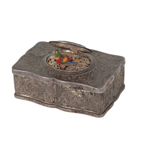 265 - A CONTINENTAL WHITE METAL AUTOMATON MUSICAL BIRD BOX the case decorated with engraved birds amongst ... 