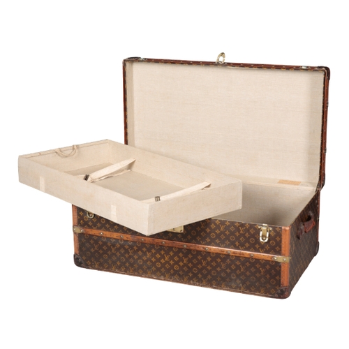 268 - A LOUIS VUITTON STAMPED LEATHER BRASS-BOUND WOODEN TRUNK with brass locks and handles, the lock to t... 