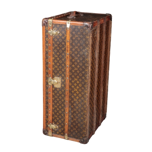 268 - A LOUIS VUITTON STAMPED LEATHER BRASS-BOUND WOODEN TRUNK with brass locks and handles, the lock to t... 