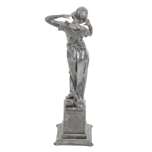 393 - A SILVERED FIGURE OF A WOMAN 20th century, cast on a plinth with relief carved panels to the side, 3... 