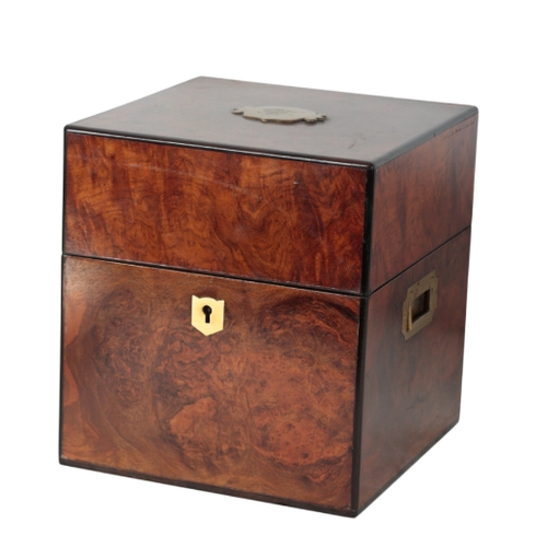 407 - A REGENCY FIGURED WALNUT TANTALUS with ebonised banding and flush handles to sides, 27cm high x 25cm... 