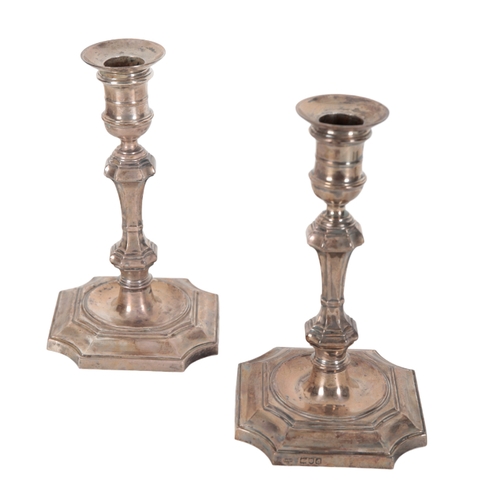 44 - A PAIR OF VICTORIAN SILVER CANDLESTICKS BY GOLDSMITHS & SILVERSMITHS CO LTD 19cm high, with loaded b... 