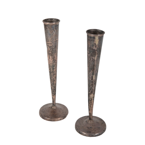 44 - A PAIR OF VICTORIAN SILVER CANDLESTICKS BY GOLDSMITHS & SILVERSMITHS CO LTD 19cm high, with loaded b... 