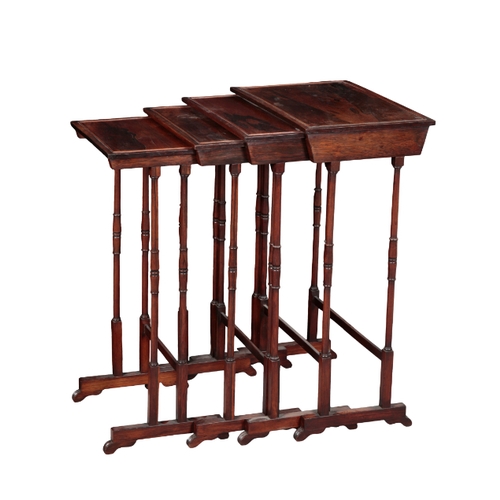 457 - A NEST OF FOUR ROSEWOOD 'QUARTETTO' TABLES with moulded rectangular tops on ring turned legs, the la... 