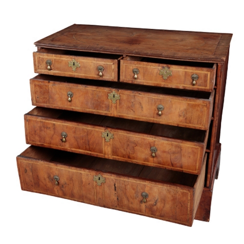 462 - A GEORGE II YEW VENEERED CHEST OF DRAWERS the top with central oval quartered and matched veneer pan... 