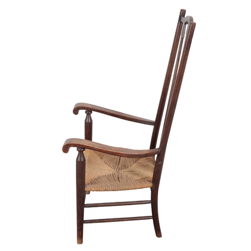 466 - AN ARTS & CRAFTS OAK ARMCHAIR early 20th Century, with tapered slatted back, scrolled arms, low wove... 