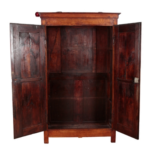 472 - A FRENCH FRUITWOOD ARMOIRE 19th century, the moulded cornice above panelled doors, opening to a vaca... 