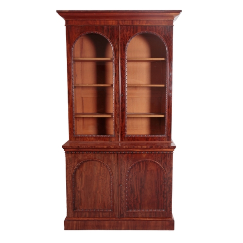 474 - A PAIR OF WILLIAM IV MAHOGANY BOOKCASE CABINETS circa 1830, each with a moulded cornice above two ar... 