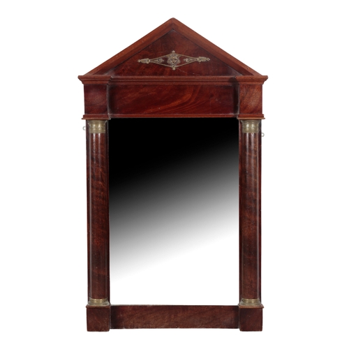 479 - AN EMPIRE STYLE MAHOGANY AND GILT METAL MOUNTED PIER MIRROR with an arched pediment and flanking col... 