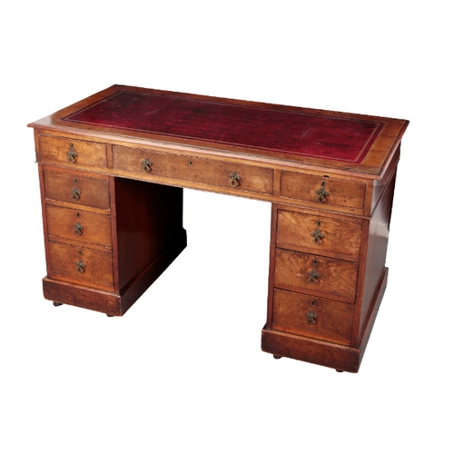 483 - A VICTORIAN MAHOGANY KNEEHOLE DESK the top inset with gilt tooled red leather, fitted nine drawers, ... 