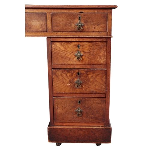 483 - A VICTORIAN MAHOGANY KNEEHOLE DESK the top inset with gilt tooled red leather, fitted nine drawers, ... 